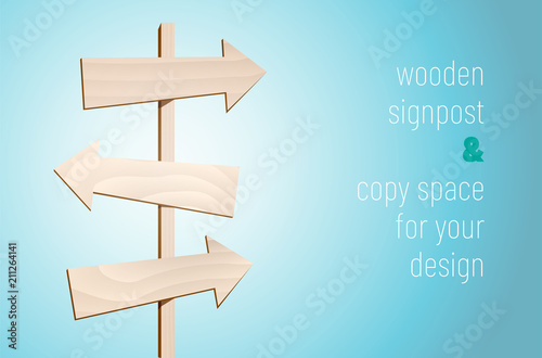 Wooden signpost with three blank arrows on blue background