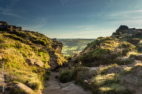 Sunset lights the heather and rocks at the Roaches, Staffordshire in the Peak District National park. 