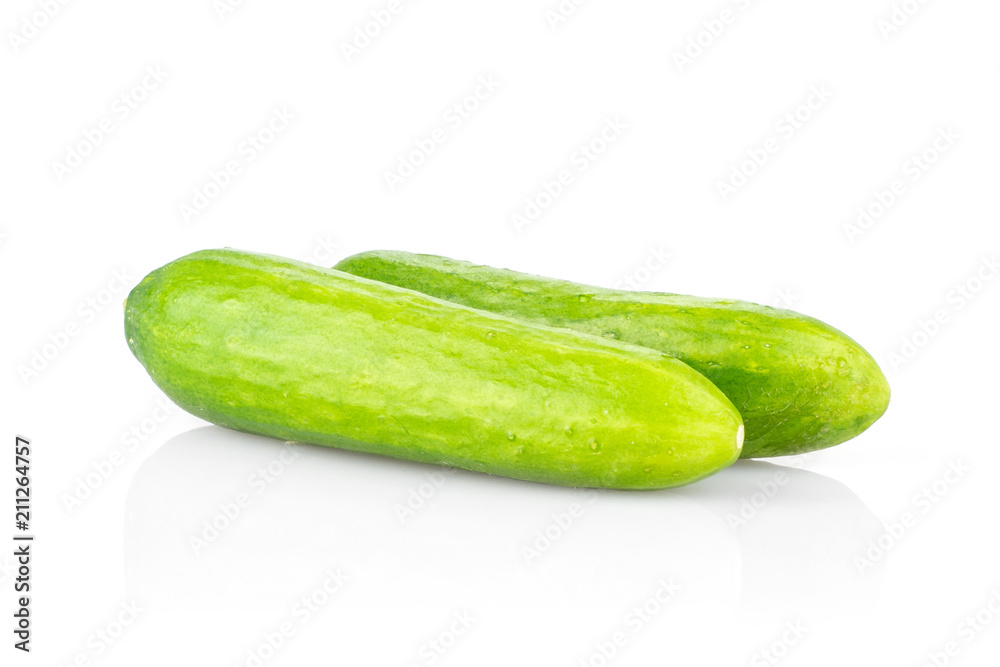 Pair of fresh green mini cucumbers isolated on white background. Pair of fresh green mini cucumbers isolated on white background.