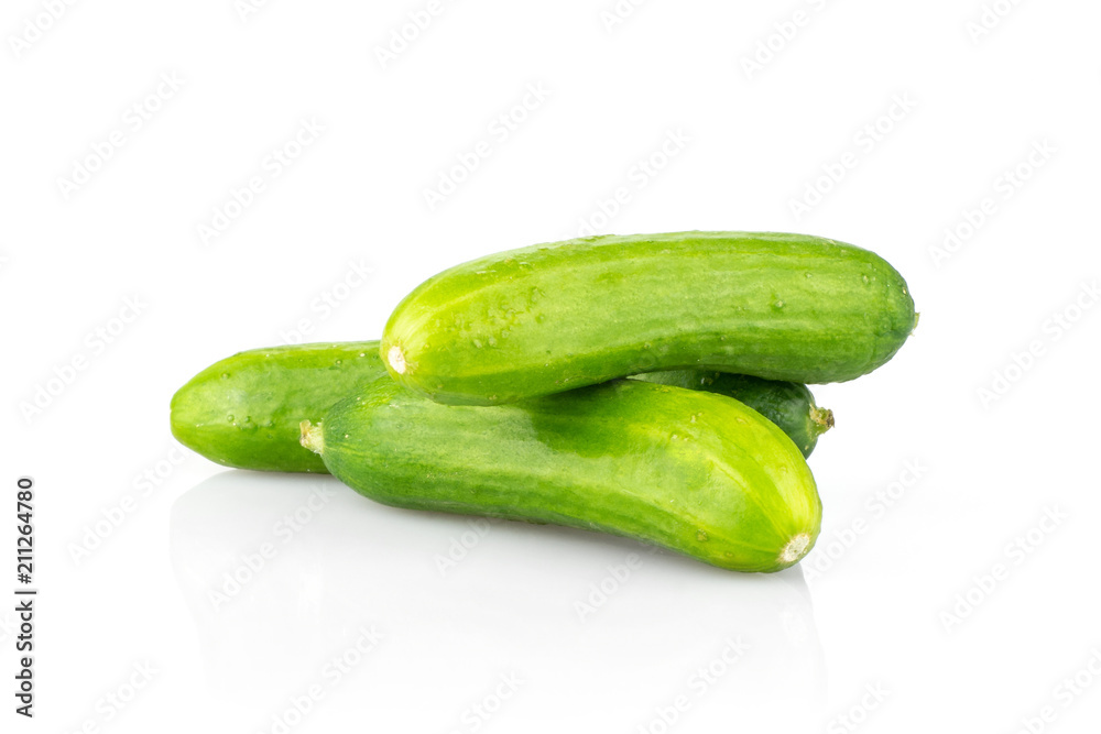 Three fresh green mini cucumbers stack isolated on white background. Three fresh green mini cucumbers stack isolated on white background.