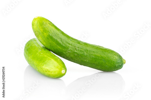 Two fresh green mini cucumbers isolated on white background.