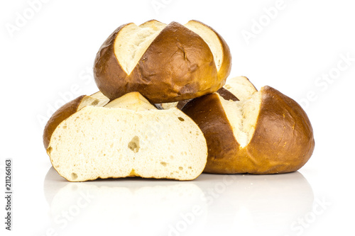 Bavarian bread buns heap and one secton half isolated on white background fresh baked loaves. photo