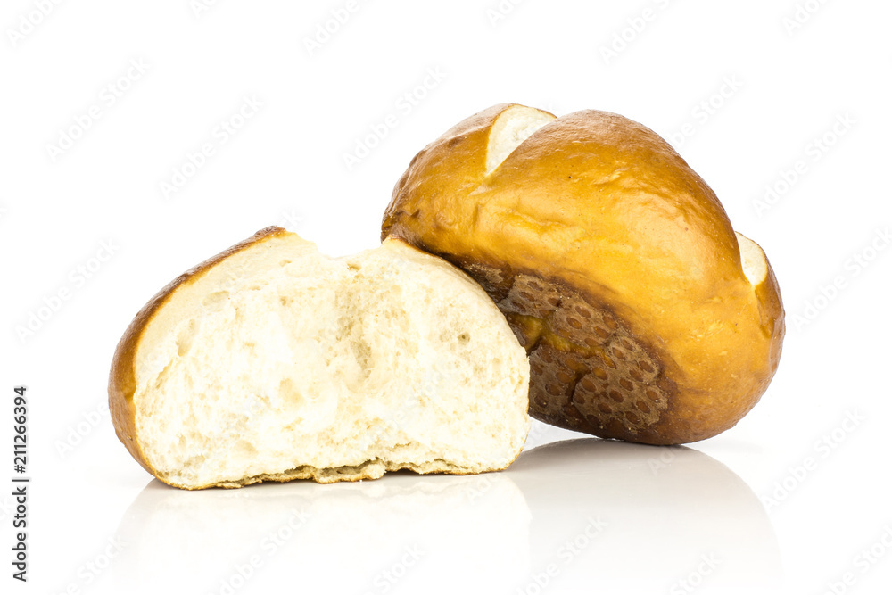 Bavarian bread bun and one cracked isolated on white background fresh baked loaves.