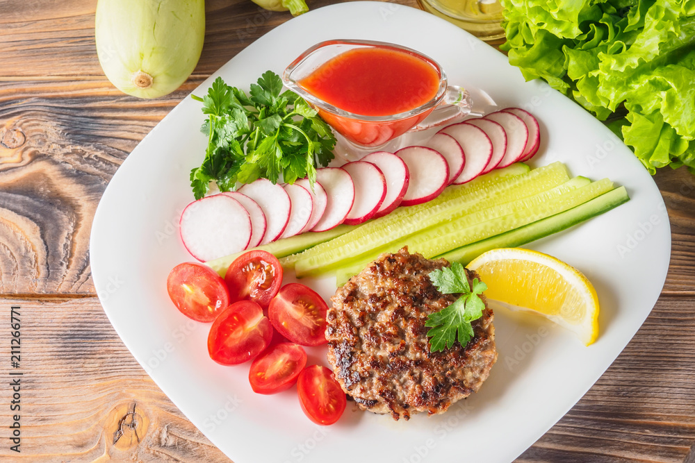 Chopped steak cutlet cooked on grill on white plate Chopped steak cutlet cooked on grill on white plate
