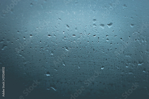 misted glass. Water on the car glass. beautiful desktop, blue, background.