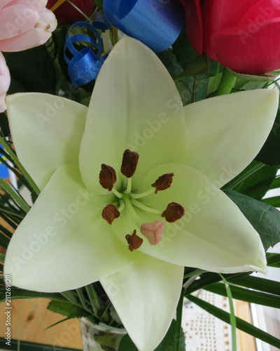 Besutiful Lily with a wonderful middle in a bouquet with other besutiful flowers photo