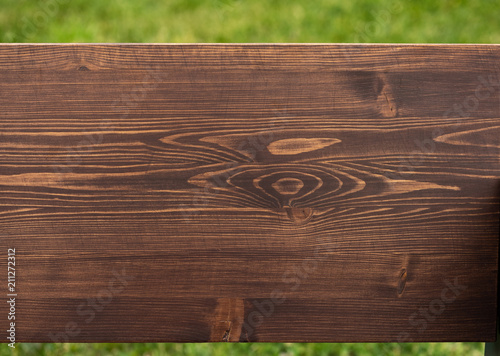 Brown natural wood texture on green background