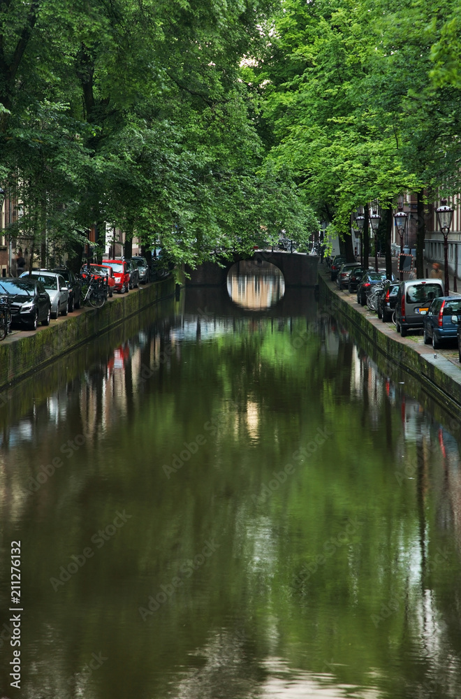 Embankment of canal at De Wallen - Red Light district. Amsterdam. Netherlands