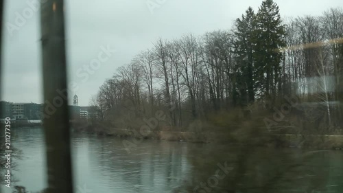 Lake landscape passing by while on a moving train during winter time2 photo