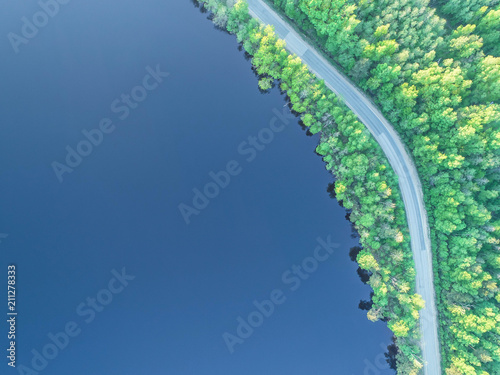 the road along the coast of the Gulf of Finland in the middle of the forest