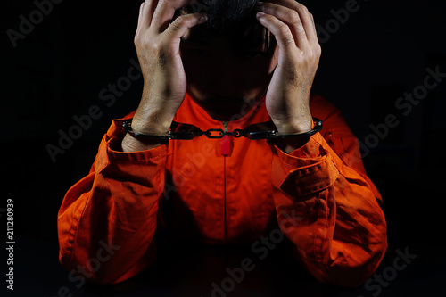 Stressed by prisoners shackled in a dark room