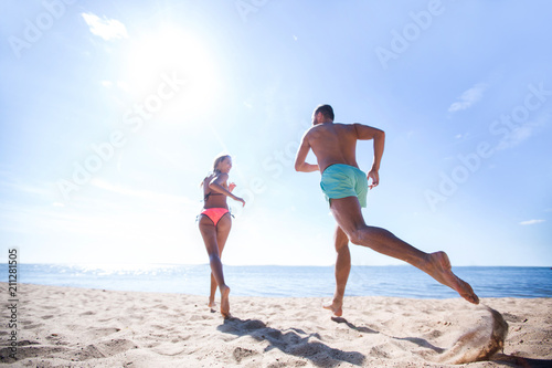 Happy Couple Running on Tropical Beach at Sunset, Vacation