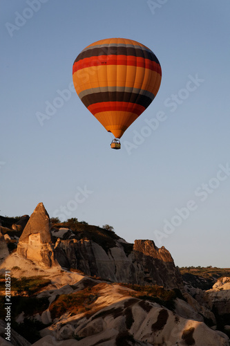 Hot air balloon flying over a fairy chimney