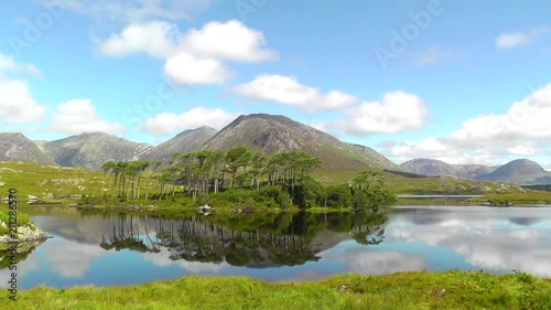A mountainous landscape reflected in Derryclare Lough, in the Inagh Valley, County Galway, Ireland. photo