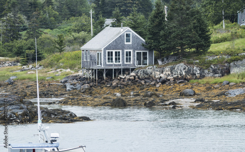 Waterfront house on stilts in Maine