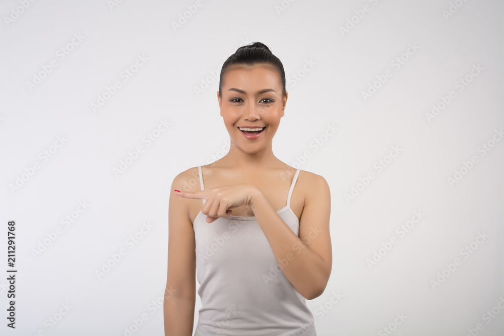 Beautiful girl with pointing to the side . Presenting your product. Expressive facial expressions Beautiful girl with pointing to the side . Presenting your product. Expressive facial expressions