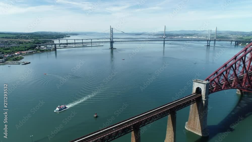 custom made wallpaper toronto digital4K aerial footage of the iconic Victorian cantilever railway bridge across the Firth of Forth near Edinburgh.