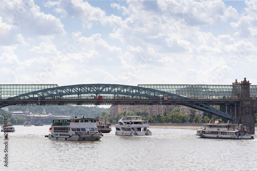 View of the glass bridge over the Moscow river with passenger ships