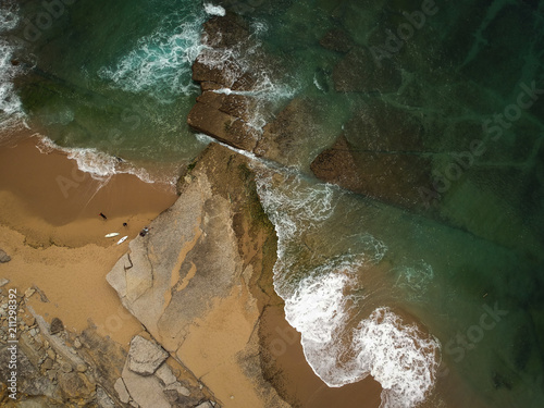 surfer on the beach top view. Drone shot on a beach in a summer day. © nvphoto