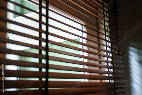 brown wood blind shade curtain and shadow