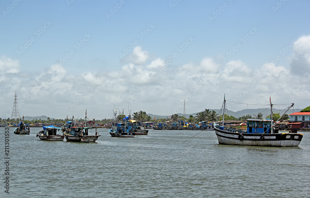 Anchored fishing boats at Cutbon Fishing Jetty, at the mouth of Sal River, adjacent to Cutbona Jetty in Goa, viewed from Betul.