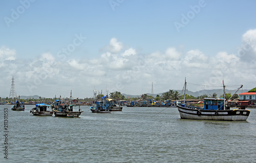 Anchored fishing boats at Cutbon Fishing Jetty, at the mouth of Sal River, adjacent to Cutbona Jetty in Goa, viewed from Betul.