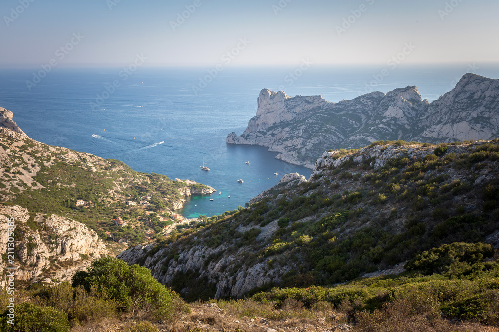 Aerial landscape view on calanque of Sormiou with boats sailing in the beautiful turquoise Mediterranean sea. Marseille, Cassis, Provence, France