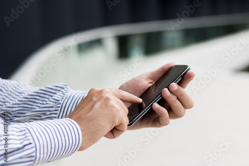 Close up of man using cell phone.