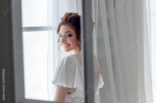 Free Download Close up portrait of beautiful young lady relaxing at the window and happy looking at camera - GFXLoad