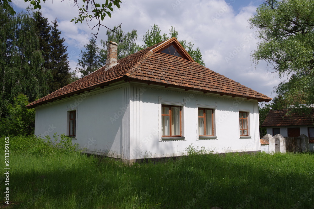 old house with white walls in the park old house with white walls in the park