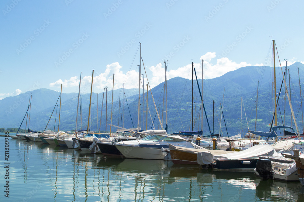 Lake with boats on the water. Beautiful landscape in Italy with boats on the water.