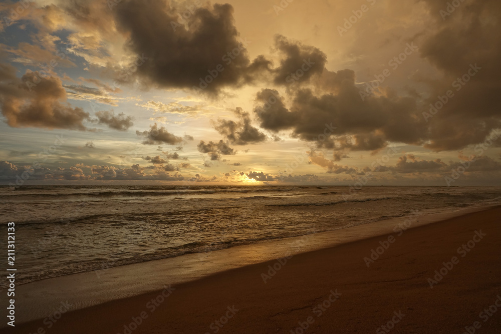 Seascape of the Indian ocean at sunset. The coast of Sri Lanka