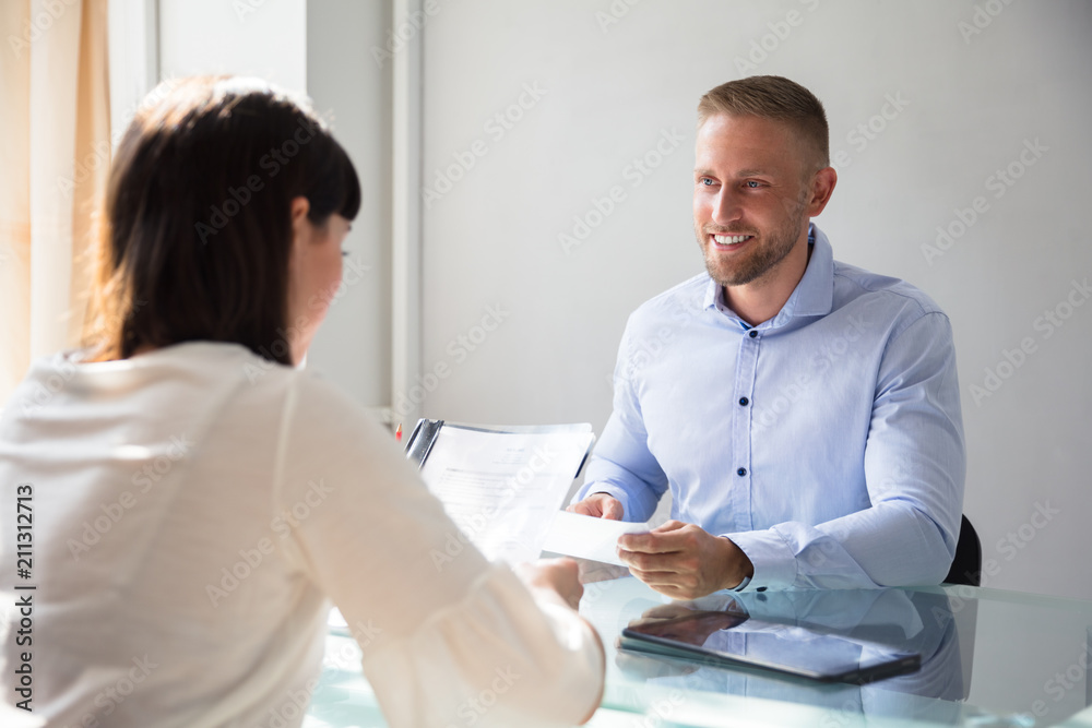 Businesswoman Interviewing Male Candidate Businesswoman Interviewing Male Candidate