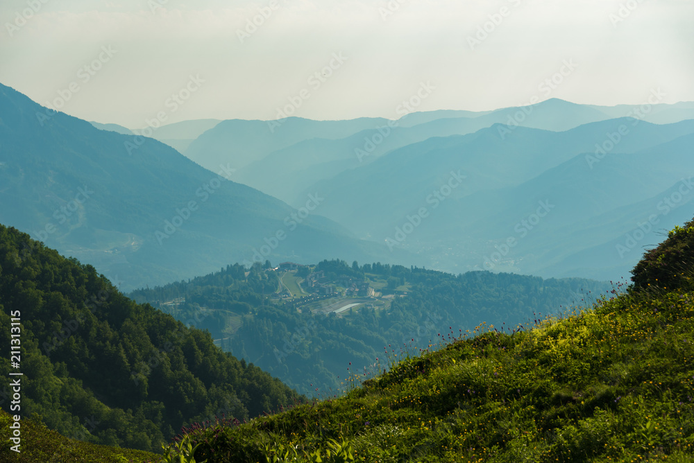 The Grand Canyon of the Bzerpi River. High mountain peaks and blue sky. Mountain tourism.