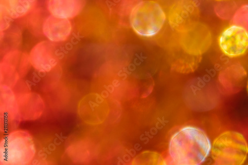 Abstract irridescent colorful bokeh background, glowing circles.