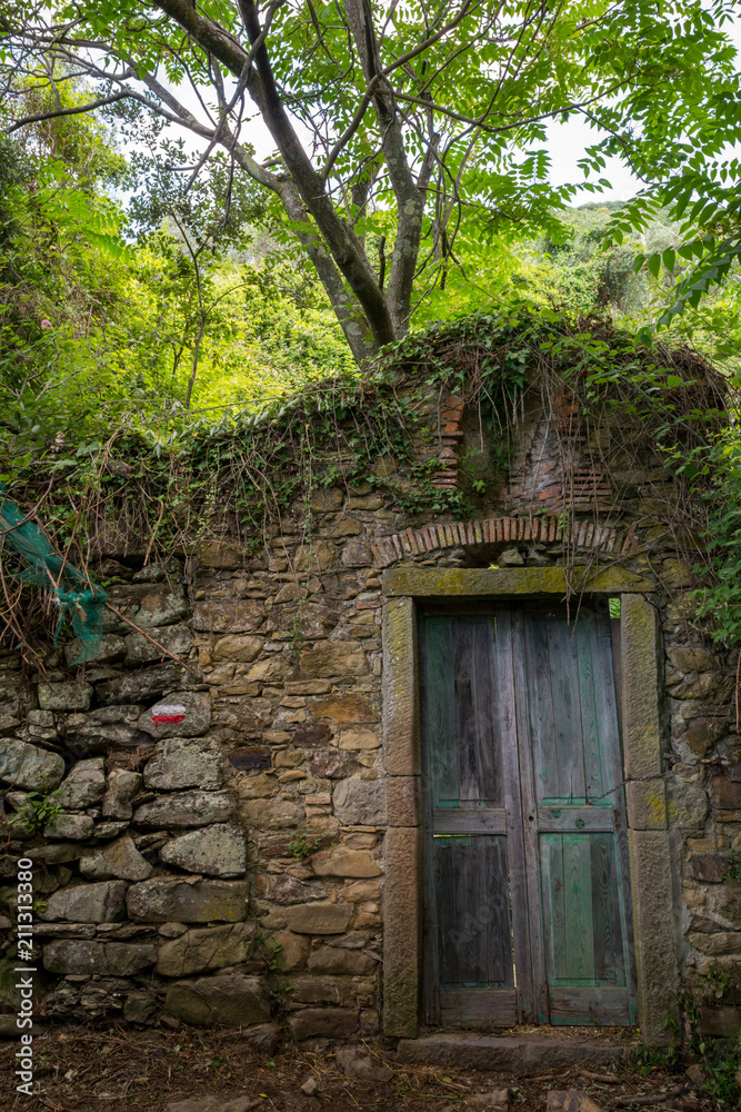 Vertical View of an Odl Door in the Path betewwn Corniglia and Vernazza at Summer Vertical View of an Odl Door in the Path betewwn Corniglia and Vernazza at Summer