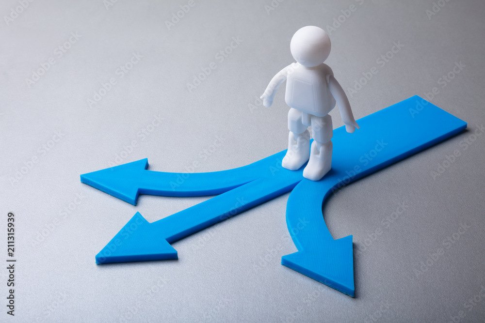 Human Figure Standing On Blue Arrow Signs Human Figure Standing On Blue Arrow Signs
