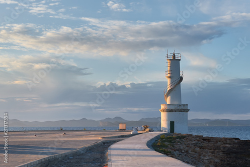 La Savina lighthouse in the port of Formentera at sunset. Spain