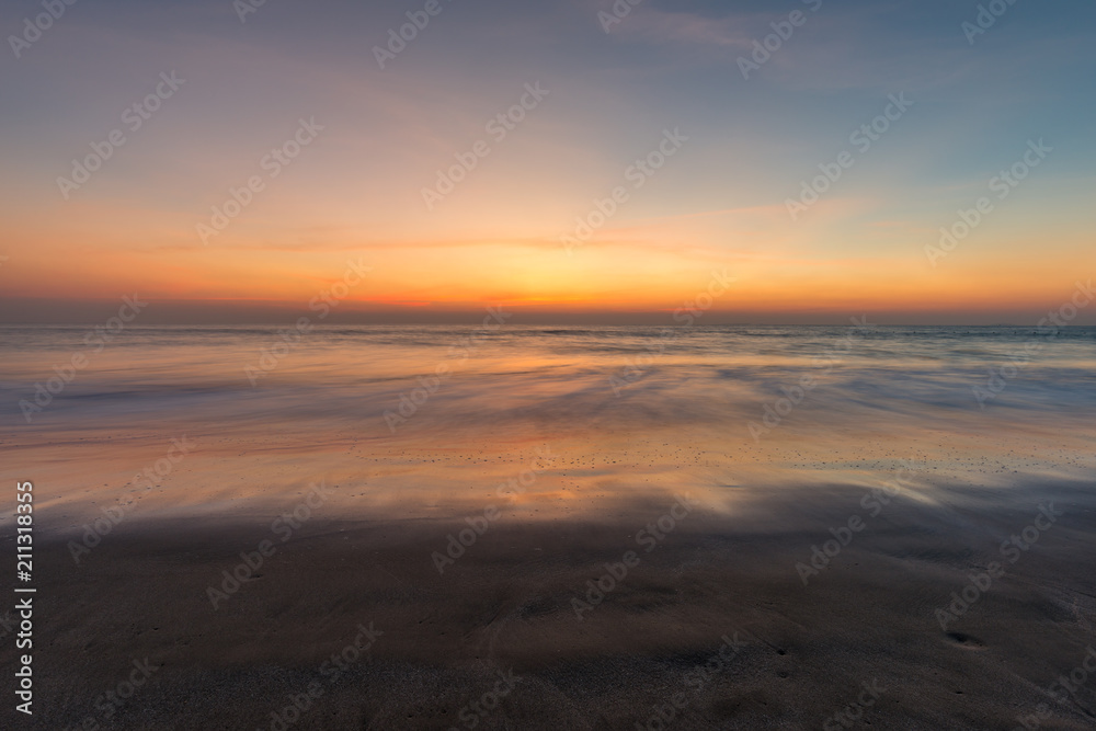 Blurred waves on the beach, sunset cloudy sky. Blurred waves on the beach, sunset cloudy sky.