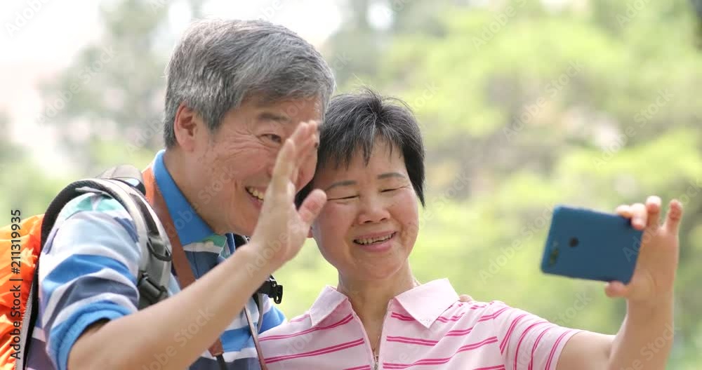 Senior couple having video call on cellphone while travel Senior couple having video call on cellphone while travel