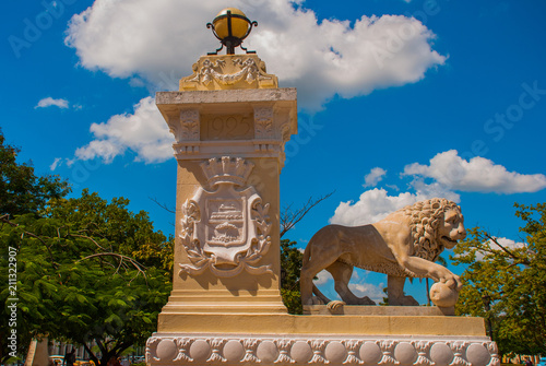 CIENFUEGOS, CUBA: Sculpture white Stone lion. View of Parque Jose Marti square in Cienfuegos. photo