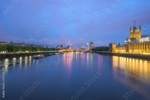 River Thames partly overlooking Wesminster palace at dawn in London. England