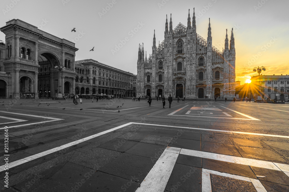 Duomo cathedral in black and white with yellow sun flare, Milan. Italy 