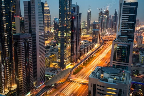 Dubai finance district illuminated at dusk, UAE