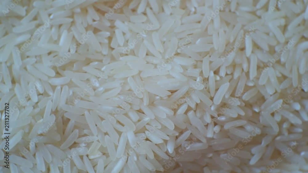 peeled ripe grain of rice.closeup.motion background peeled ripe grain of rice.closeup.motion background