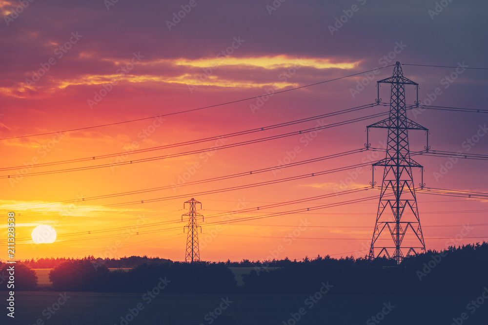 Electric transmission towers at sunset