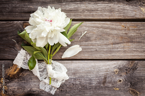 Fototapeta Naklejka Na Ścianę i Meble -  Bunch, bouquet of white  peonies on a wooden background. Frame of flowers. Colorful background