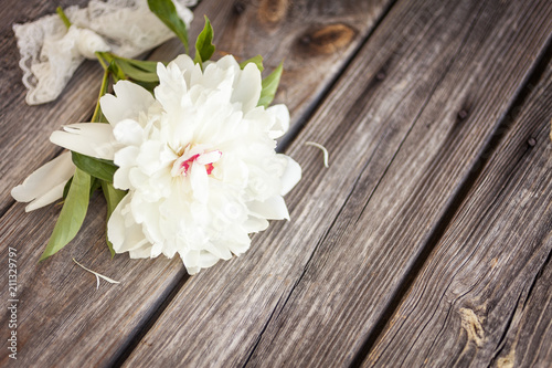 Fototapeta Naklejka Na Ścianę i Meble -  Bunch, bouquet of white  peonies on a wooden background. Frame of flowers. Colorful background