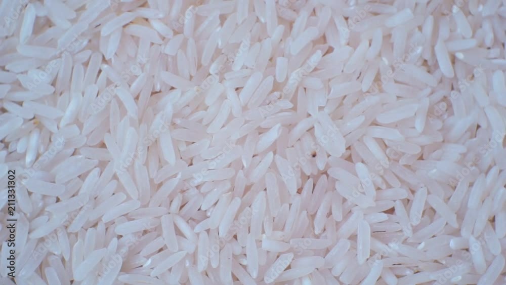 peeled ripe grain of rice.closeup.motion background. peeled ripe grain of rice.closeup.motion background.