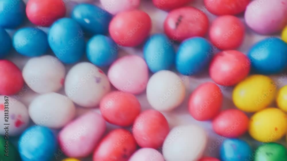 small glazed candies of different colors.closeup.abstract moving background for your design. small glazed candies of different colors.closeup.abstract moving background for your design.